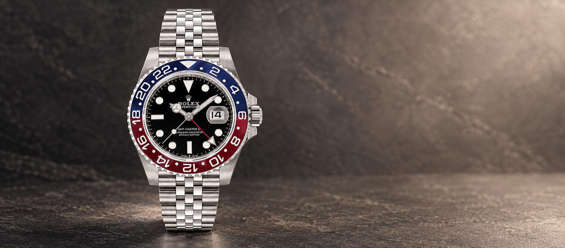 Rolex GMT-Master II 126710BLRO with red-and-blue Cerachrom bezel and steel Jubilee bracelet against a warm charcoal background
