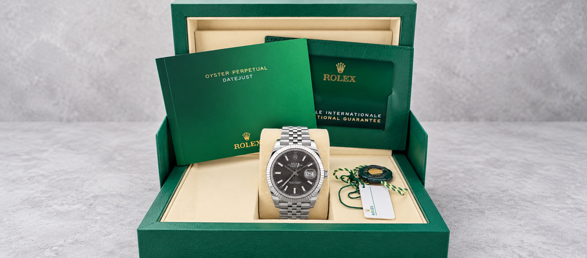 Rolex Datejust 41 reference 126334 with rhodium dial and stainless steel Jubilee bracelet displayed with its green box and presentation materials