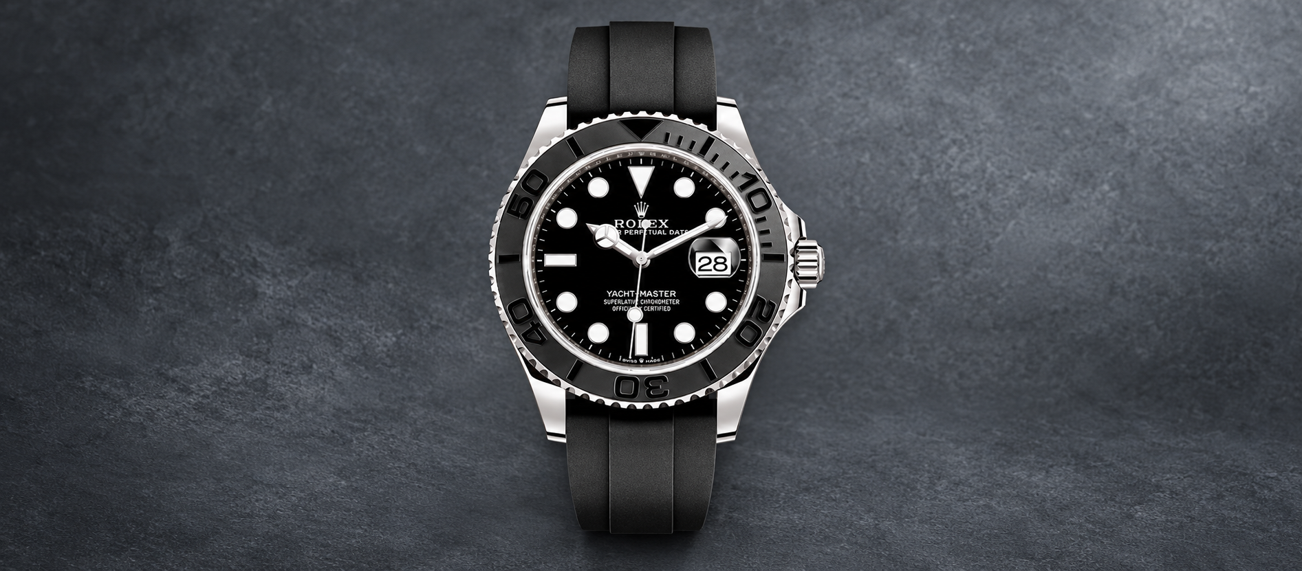 Rolex Yacht-Master 42 226659 in white gold with black dial, black Cerachrom bezel and Oysterflex bracelet against a slate-gray background