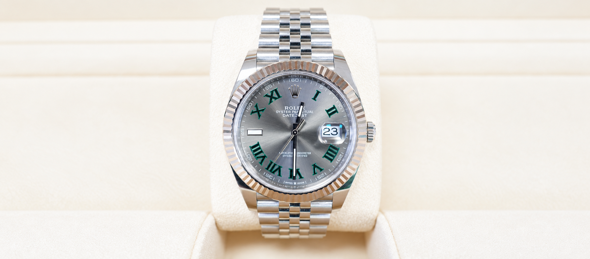 Rolex Datejust 41 Wimbledon 126334 with slate dial, fluted bezel and Jubilee bracelet on a cream watch cushion