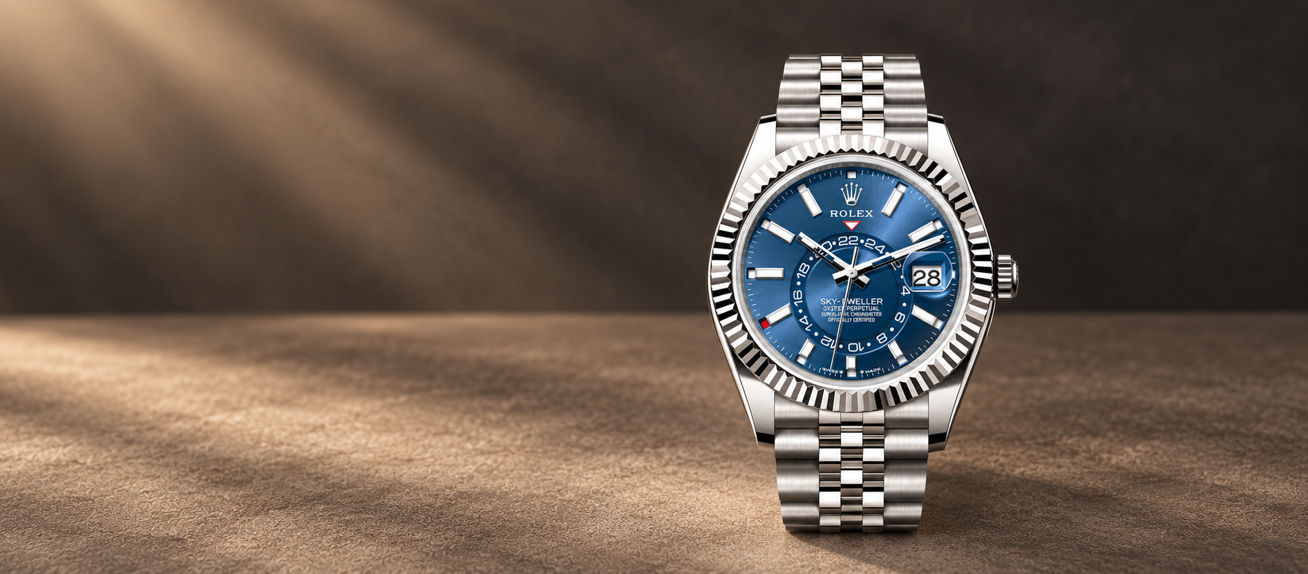 Rolex Sky-Dweller 336934 with bright blue dial, fluted bezel and steel Jubilee bracelet against a warm charcoal-taupe background.